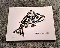 Front of ceramic tile with Indigenous Pacific Salmon design highlighted with 24k gold.