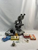 Front view of Olympus microscope with all accessories arranged