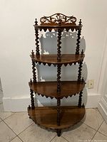 Full front view of the four-tier half-round whatnot shelf