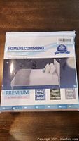Front packaging image showing the HomeRecommend Premium mattress protector with 10-year warranty and mattress protection features.