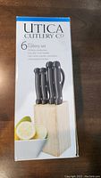 Box packaging of Utica 6-piece cutting tool block set showing six knives in a wooden block.