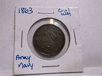 Obverse side of 1863 Civil War Army Navy penny token showing lady profile and stars