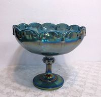 Full view of the blue carnival glass candy/fruit bowl showing scalloped edge and iridescent finish.