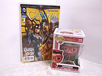 Photo showing Catwoman DC Comics #1 Annual comic and Catwoman Funko Pop figure boxed.