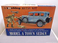 Box front of Hubley Model A Town Sedan metal model kit with vintage style graphics and blue car illustration.