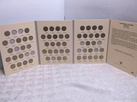 Full view of four-panel folding coin display book showing mostly filled slots for Jefferson nickels from 1962 to 1996.