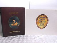 Brown slipcover with gold text reading 'Snow White Storybook Ornament Set' and an image of Snow White with forest animals