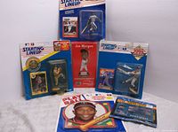 Five Starting Lineup baseball figures in original blister packaging displayed standing together, including a Joe Morgan figure with red card backing.