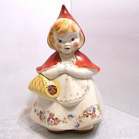 Full view of the Red Riding Hood cookie jar showing figure, colors, and floral decoration on dress.