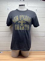 Front view of the New Orleans Saints t-shirt showing printed logo and text