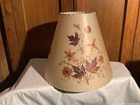 Front view of Dornbush lamp shade showing floral pressed design and natural cream background.