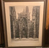Framed etching artwork showing the entire framed piece including the Rouen Cathedral illustration and frame details.