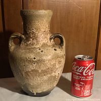 Front view of the MCM lava glaze ceramic vase with soda can for size reference.