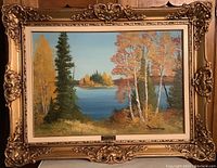 Full view of the framed painting showing the Thousand Islands landscape in fall colors.