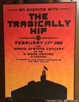 Front view of concert plaque featuring event details for The Tragically Hip's February 23, 2008 grand opening concert at Kingston K Rock Centre with silhouette image and text on gradient background.