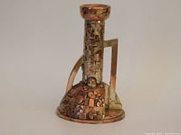 Front angle view showing full form, handle and relief pattern