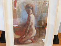 Frontal view of framed gouache painting against white background