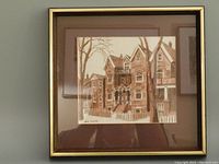 Framed watercolor painting of Toronto street scene in brown tones with a gold trim frame.