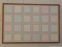 Full front view of the abstract painting showing the grid of pastel-colored nested squares in wood frame