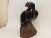 Front angle photo of the hand carved rosewood eagle sculpture showing detailed carving and polished surface