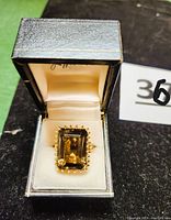 Ring in original black presentation box showing overall look
