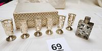 All six sterling silver overlay cordial shot glasses and matching bottle displayed with carrying case in background.