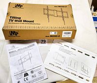 Closed box labeled Mounting Dream Model MD2268-LK with installation instructions and mounting template on table.