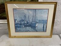 Framed print of sailboats in harbor by Emile Gruppe showing overall artwork and frame.