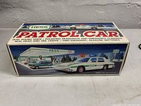 Front view of the original box packaging with product name and image of the Hess 1993 Patrol Car toy showing its design and features.