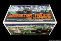 Box showing the front of the Hess Monster Truck with Motorcycles set, including graphics of the truck and motorcycles in a snowy scene with branding and features.