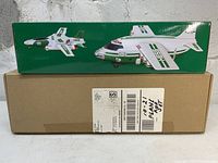 Front side of the unopened Hess Cargo Plane Jet box with images of the plane and jet, sitting on original shipping box.