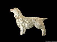 Close-up photo of the sterling silver spaniel dog pin showing detailed texture and finish