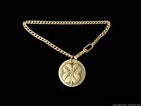 Clear front view of the sterling silver bracelet on a black background showing the four leaf clover charm and chain details.