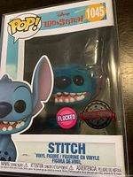 Front view of Funko Pop box displaying Stitch figure with flocked texture and special edition stickers.