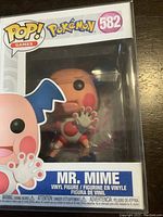 Front view of Funko Pop box showing Mr. Mime figure with Pokémon and Pop Games logos and item number 582.