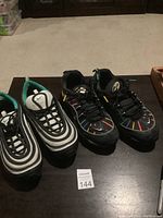 Two pairs of Nike Air Max shoes with size 11 labels visible.