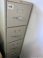 Front view of the 4 drawer filing cabinet showing drawers and handles.