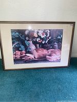 Full front view of the framed puzzle showing the entire puzzle image behind glass within wooden frame.