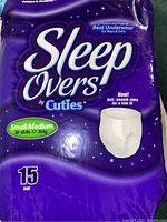 Photo of sealed purple pack of Sleep Overs by Cuties Small/Medium size containing 15 pairs.