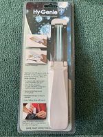 Hy-Genie UV-C Portable Sanitizer device sealed in original plastic clamshell with packaging text visible about uses.