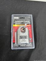Front view of Kasp 11960X hardened combination padlock in sealed retail packaging showing brand, model, and security information.