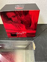 Box of Helight Sleep device showing woman using the device and product name.