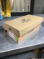 Closed original Sperry shoe box with label showing brand and size 6.5