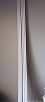 Close-up view of the profile detailing on the mouldings, showing subtle curved and ridged design.