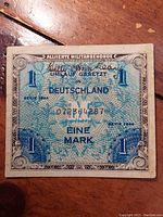 Front view of WWII Allied Military Currency 1 Mark note with serial number and series date shown.
