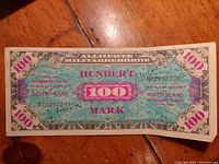 Front side of 1944 Allied Military Government issued 100 Mark banknote for Germany from WWII Allied Military currency series.