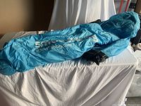 Blue Smoothbag inflatable lounger laid out partially inflated on a surface.