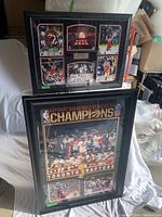 Two framed Toronto Raptors 2019 NBA Championship posters stacked, showing front images and frames.