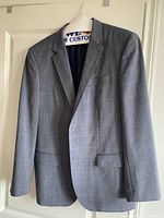 Gray checked Hugo Boss suit jacket hanging showing front and details