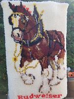 Front view of the hand hooked Budweiser Clydesdale wall hanging showing detailed horse portrait and logo text.